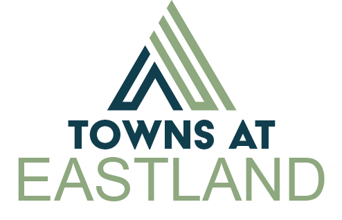 A logo with the text "Towns at Eastland" in front of a white background.